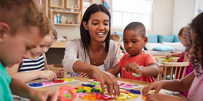 Young teacher with students