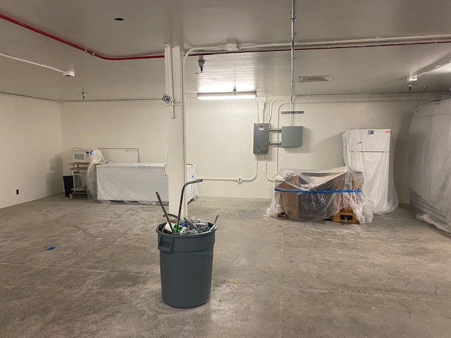 Large, open room with trash bin in middle