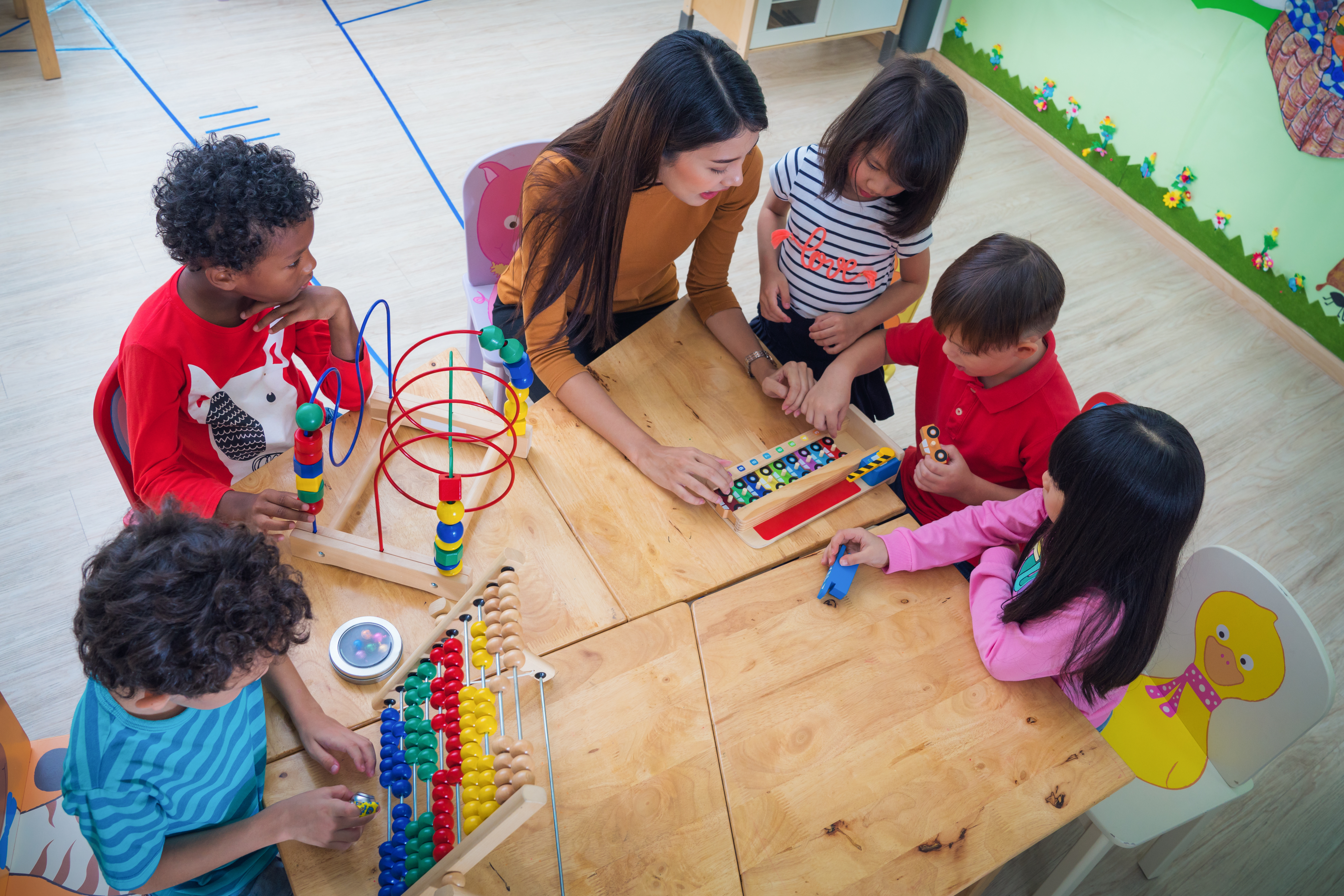 Preschool Teacher with young students